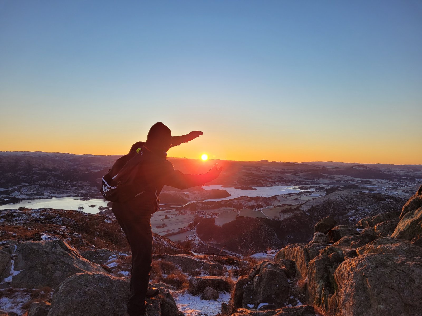 Kwame Richman hiking in the mountains at sunset